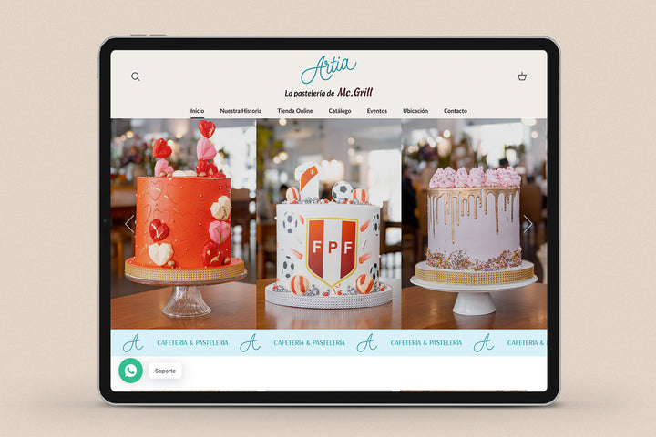 Imagen de un ipad con la web de Artia Pastelería en su pantalla.