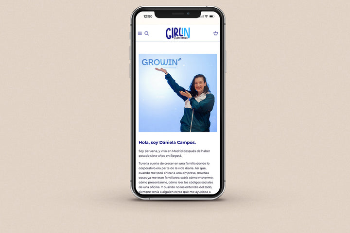 Imagen de un iphone con la web de Girl in Corporation en su pantalla.