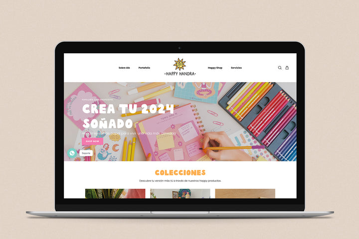 Imagen de una laptop con la web de Happy Handra en su pantalla.