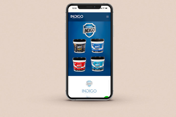 Imagen de un iphone con la web de Pinturas Índigo en su pantalla.