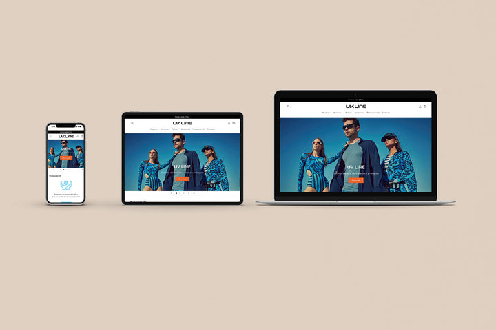 Un Iphone, un Ipad y una laptop mostrando cada uno el inicio de la página web de UV Line. Los tres dispositivos están uno al lado del otro sobre un fondo color entero beige. 