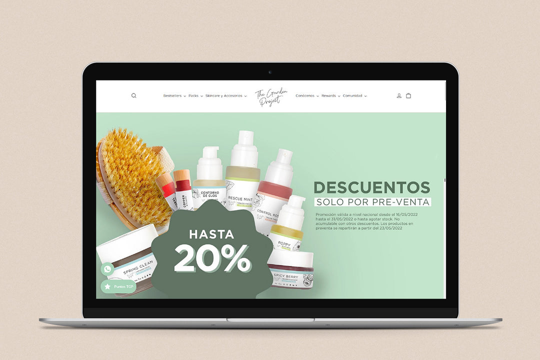 Imagen de una laptop con la web de The Garden Project en su pantalla.