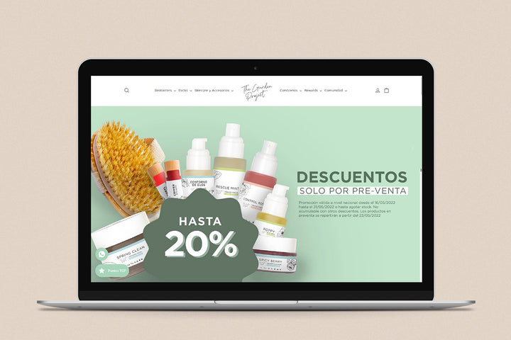 Imagen de una laptop con la web de The Garden Project en su pantalla.